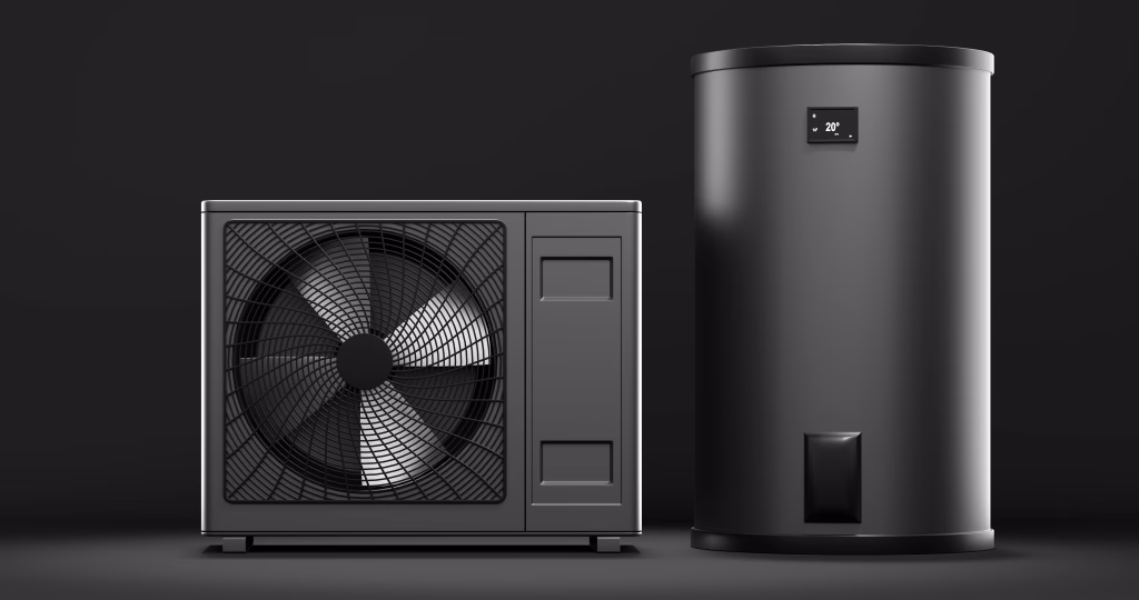 Dark grey air-to-water heat pump beside a matching cylinder tank on a dark background