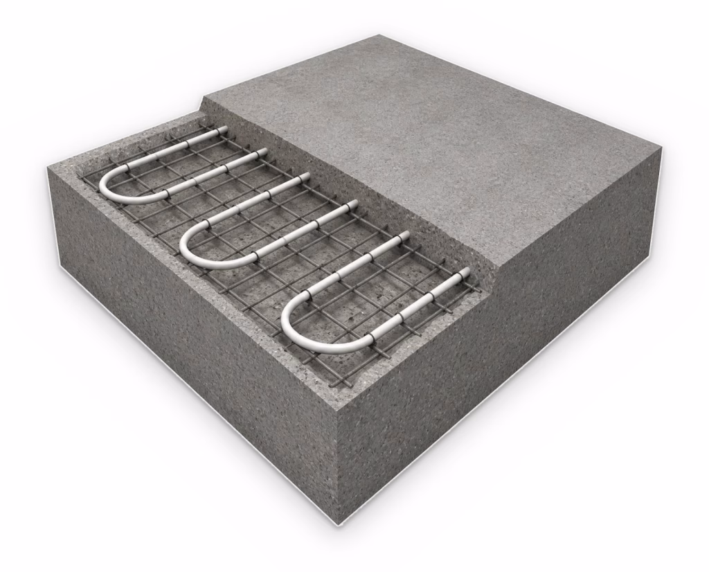 Cutaway of a concrete slab with white heating pipe tied to the steel reinforcement mesh in a serpentine layout. Part of the slab is cut back to show the pipe cast into the concrete.