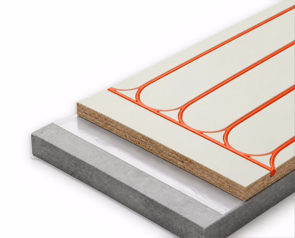 Warmboard-R panel laid on a concrete slab over reflective foil: an OSB panel with an aluminium top, and orange pipe seated in routed channels in long straight runs joined by curved loops.